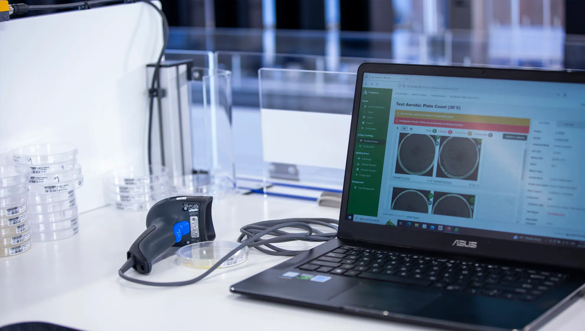 Lab technician work station in the colony counting system.